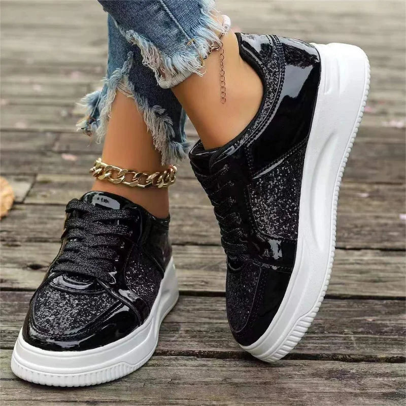 Women’s black metallic sequin lace-up platform sneakers with thick white sole and chain strap