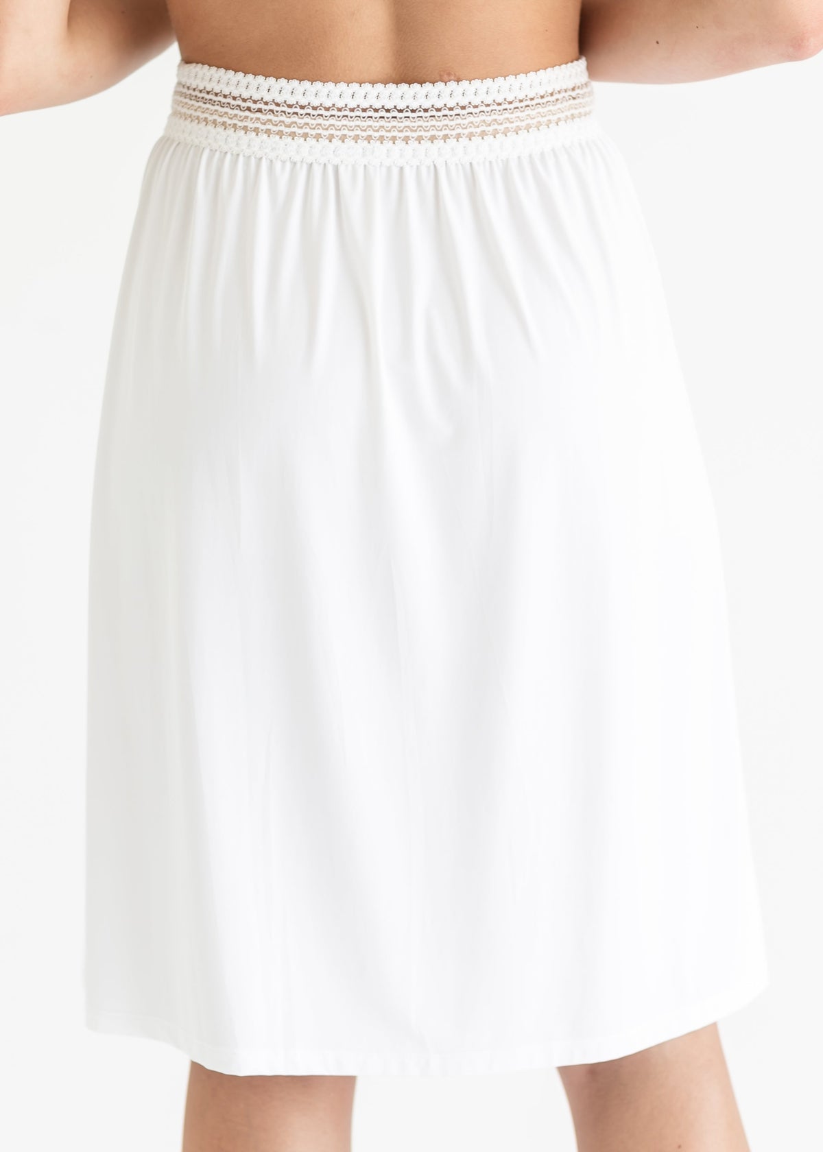 White half slip with elastic waistband detail and softly pleated fabric