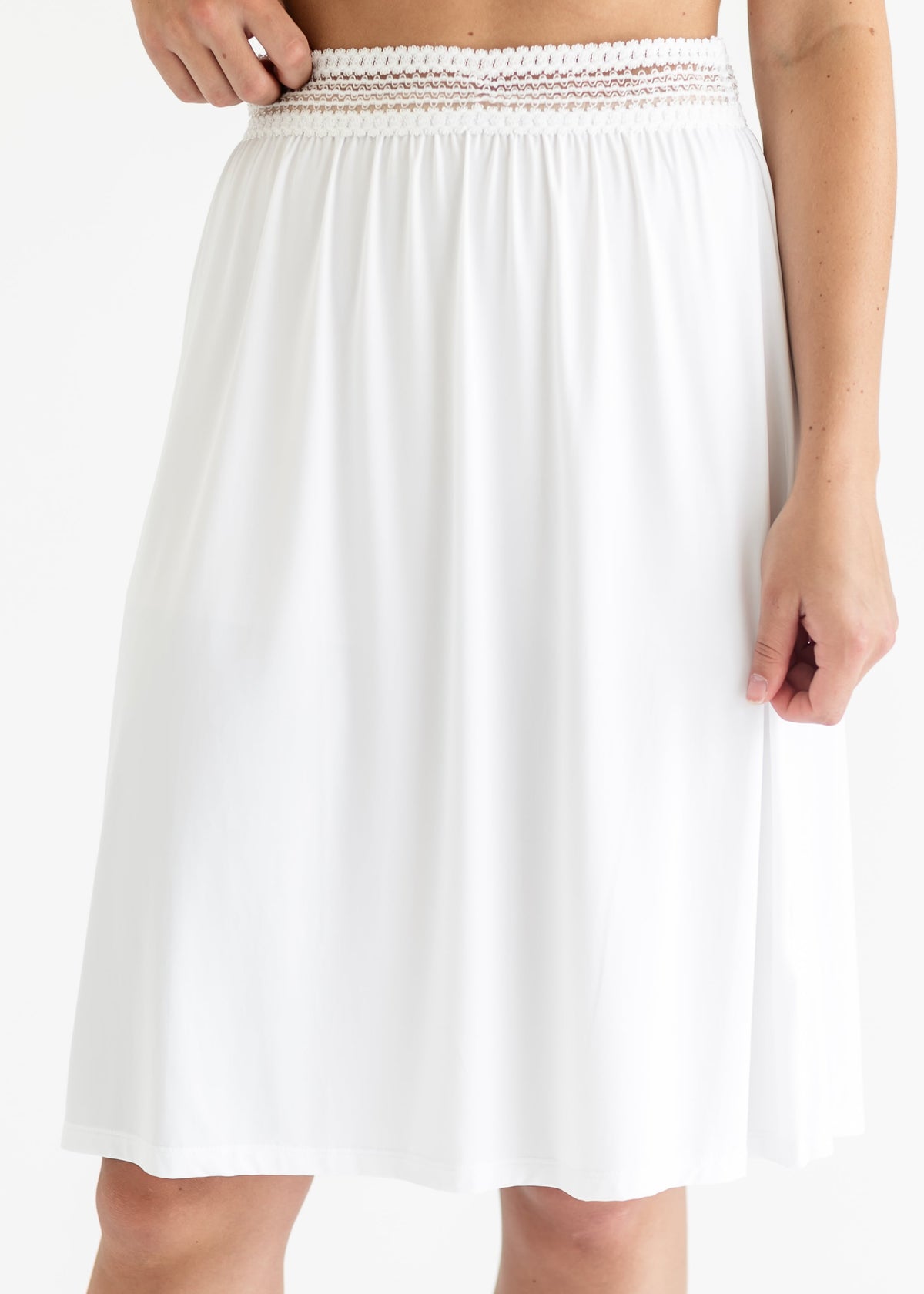 White half slip with wide elastic waistband and smooth A-line skirt