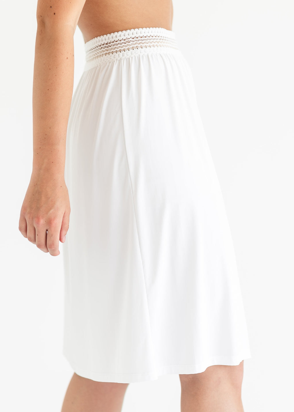 White half slip with elastic waist and gathered flare to mid-thigh