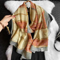 Women’s large scarf in cream and gold with ornate border and warm-toned motifs