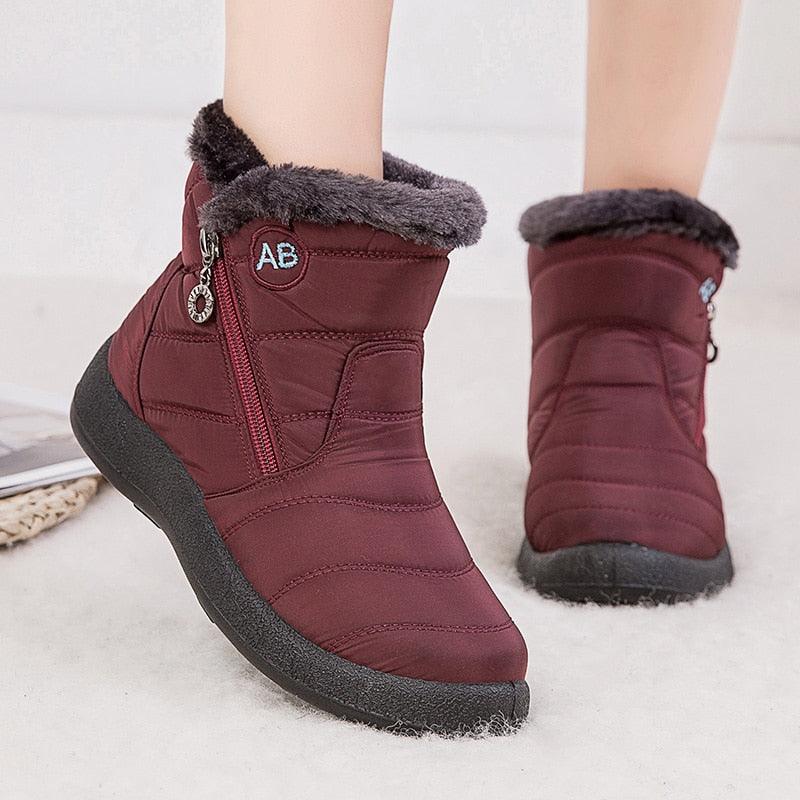 Women’s burgundy winter ankle boots with faux fur trim and side zipper