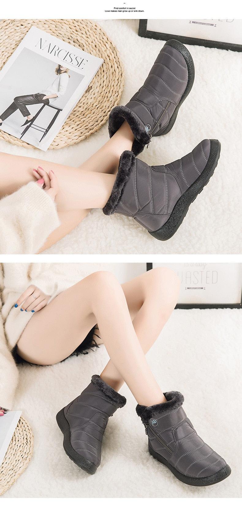 Dark gray ankle snow boots with faux fur lining and side zipper, on model