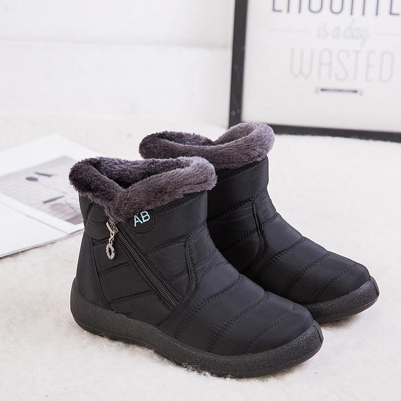 Women’s winter ankle boots, black quilted uppers with faux-fur cuffs and side zipper