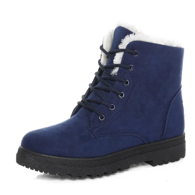 Navy ankle boot with lace-up front, white faux-fur trim, and treaded rubber outsole