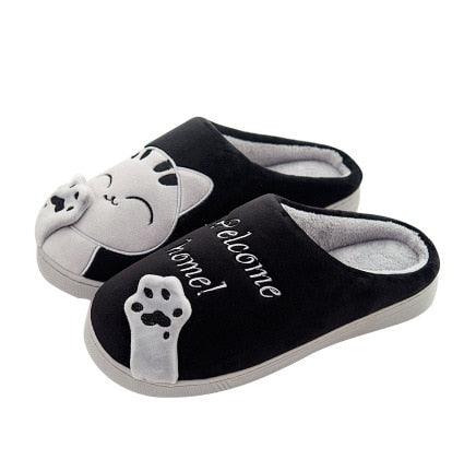 Women’s black cat slippers with plush lining, slip-on house shoes and paw print