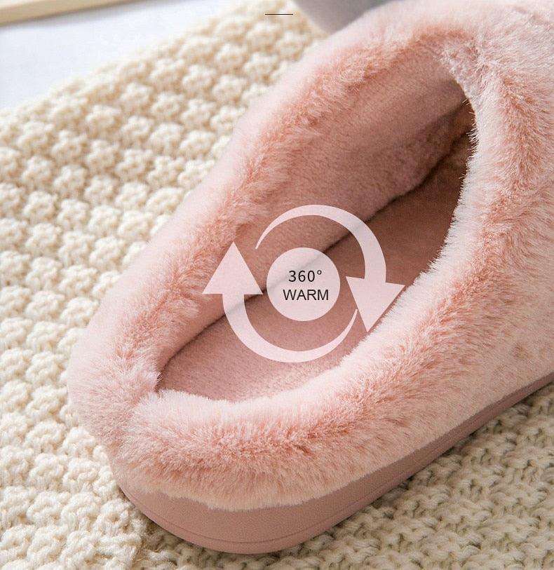 Plush pink slipper with warm fur-like interior and cushioned curved sole