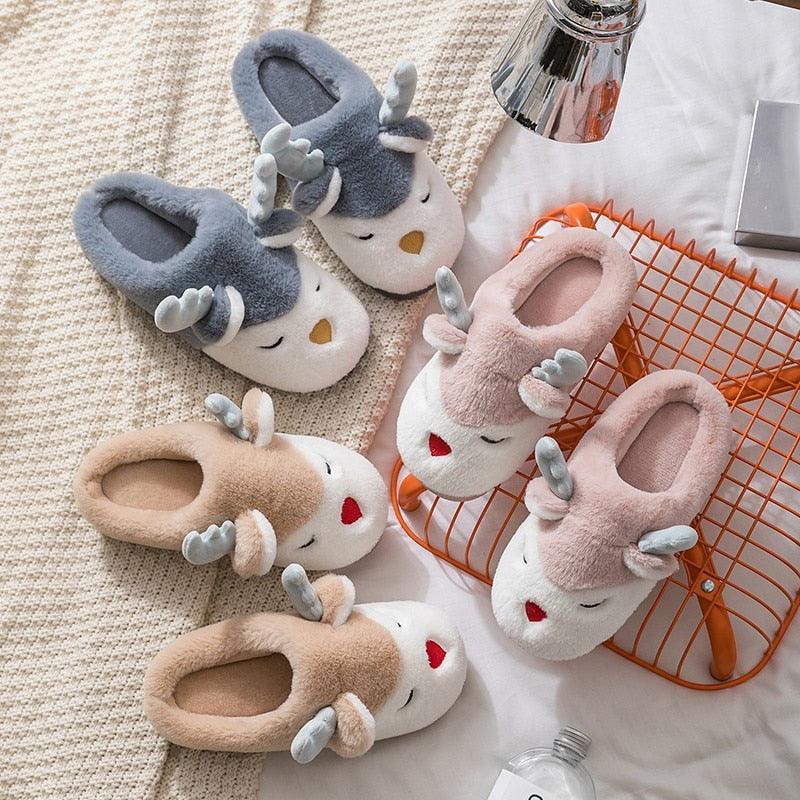 Set of plush animal-face slippers in blue, pink, and tan with fuzzy lining