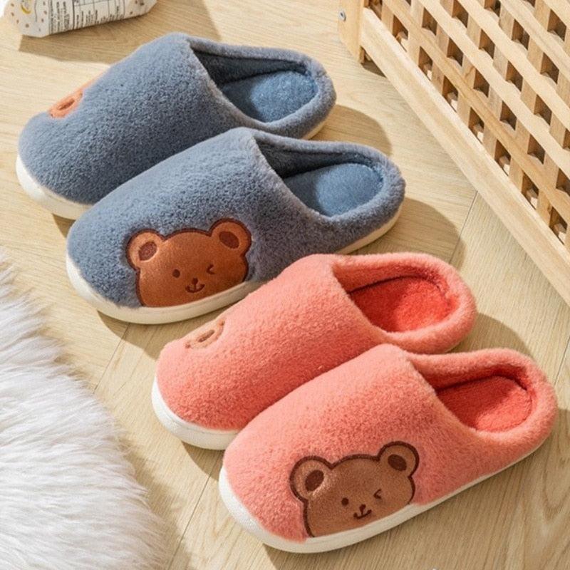 Blue and coral fleece slippers with cartoon bear face appliques and cushioned soles