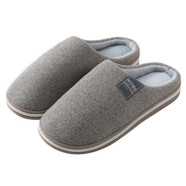 Grey herringbone knit house slippers with light blue lining and rubber sole
