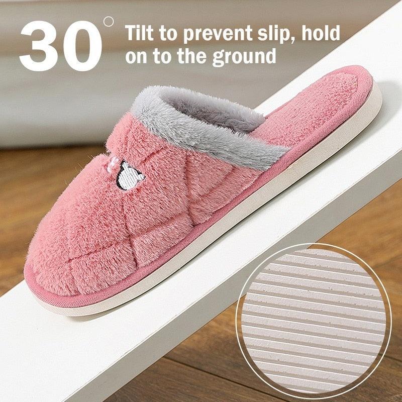 Pink fleece house slipper with textured anti-slip sole pattern for grip