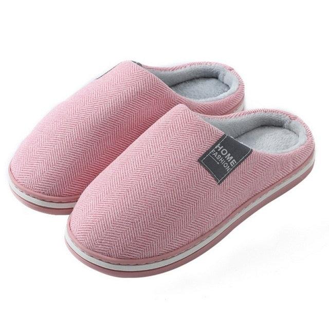 Pink herringbone house slippers with light blue lining and rubber sole
