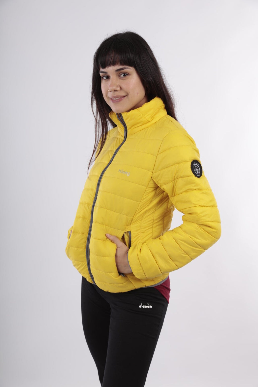 Yellow alpaca puffer jacket with hood, full-zip, and side patch detail