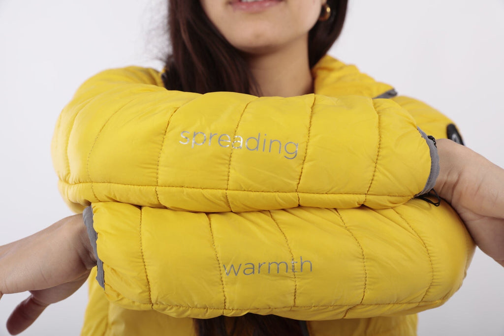 Yellow women's puffer jacket with padded collar and zip-front design