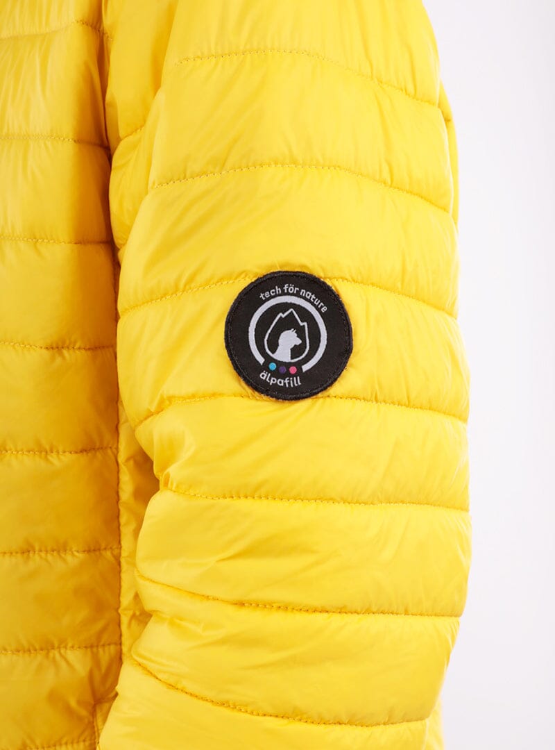 Yellow puffer jacket sleeve with round Alpafill logo patch