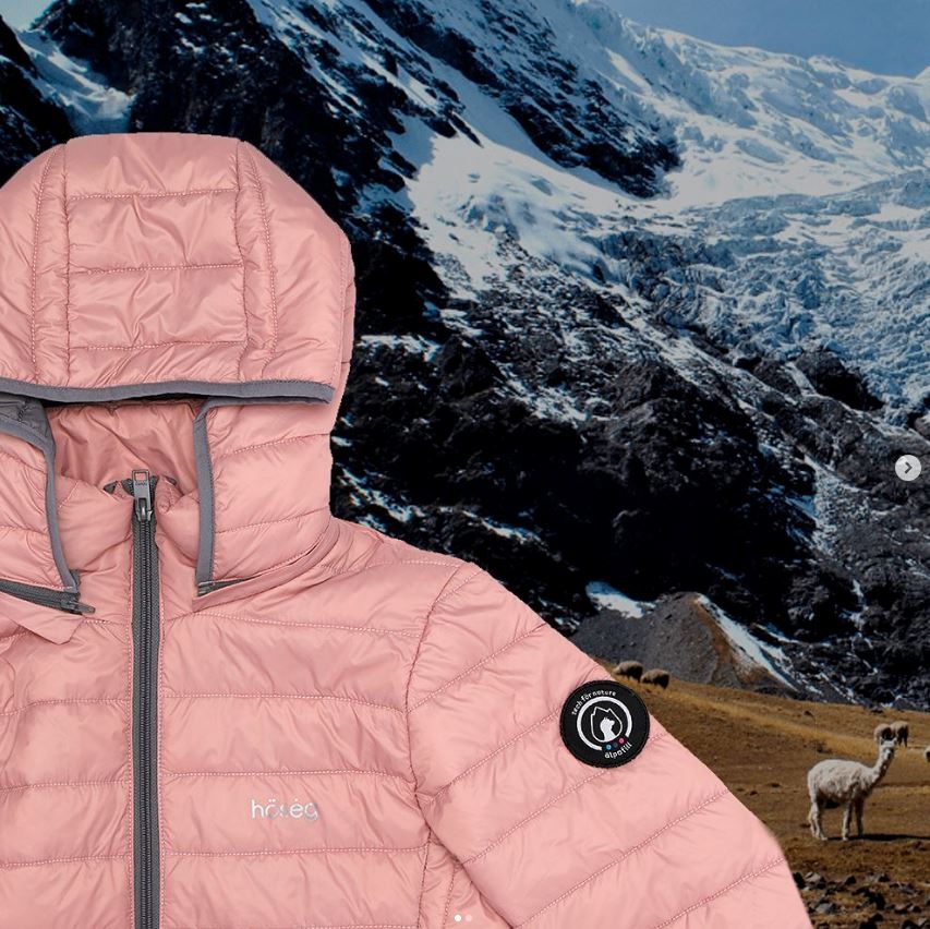 Mauve hooded puffer jacket with black zipper and circular logo patch