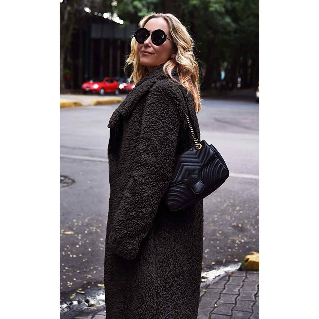 Black fuzzy fleece long cardigan coat with open front and lapels, side view