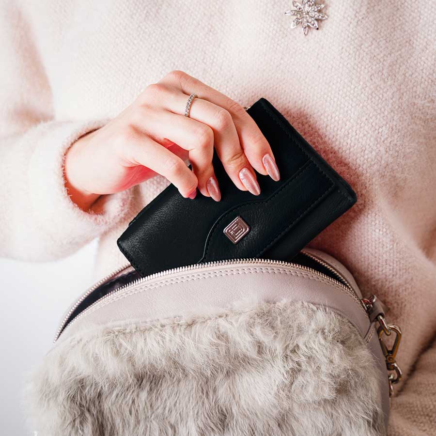 Black leather trifold wallet with snap tab and embossed logo