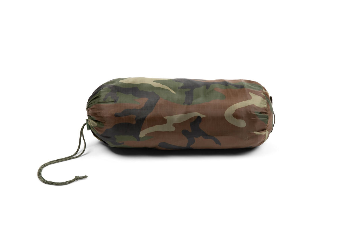 Woobie blanket rolled up in woodland camo with attached drawstring cord