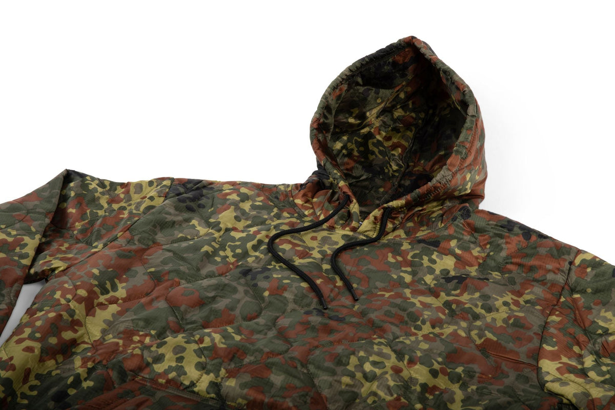 Woobie hoodie camouflage print with attached hood and black drawstring, front view close-up.