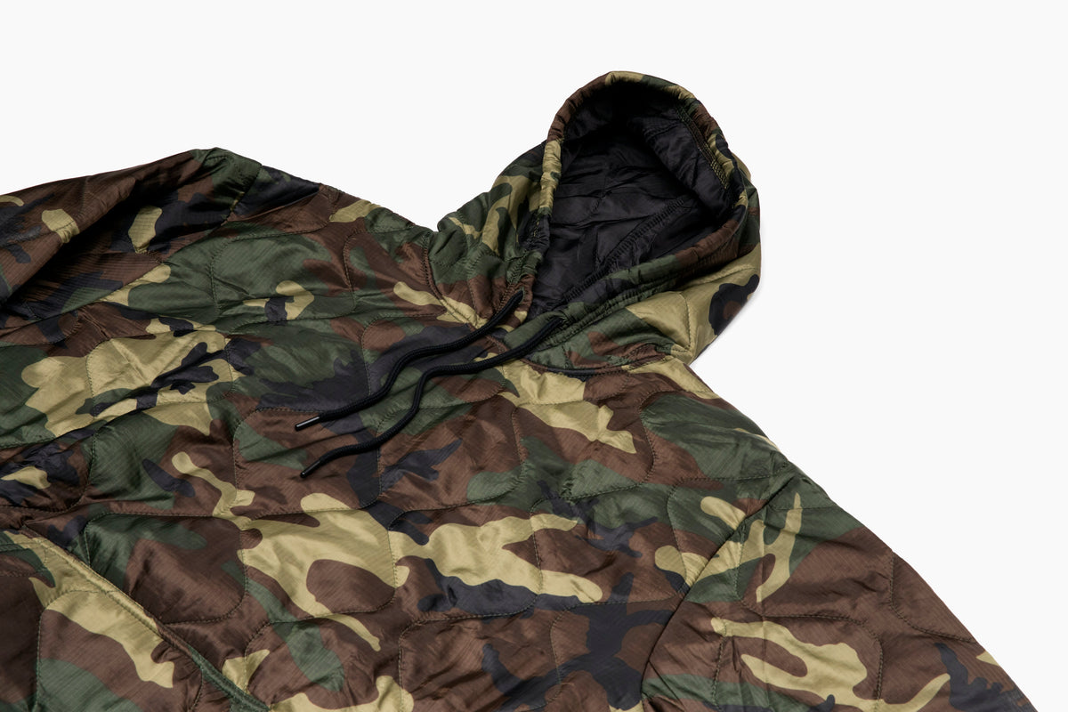 Woobie hoodie camouflage print hooded pullover with black drawstring, close-up chest.