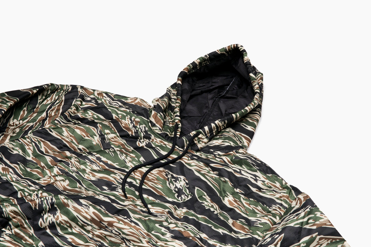 Woobie hoodie zebra-style camo print with hood and black drawstring, close-up.