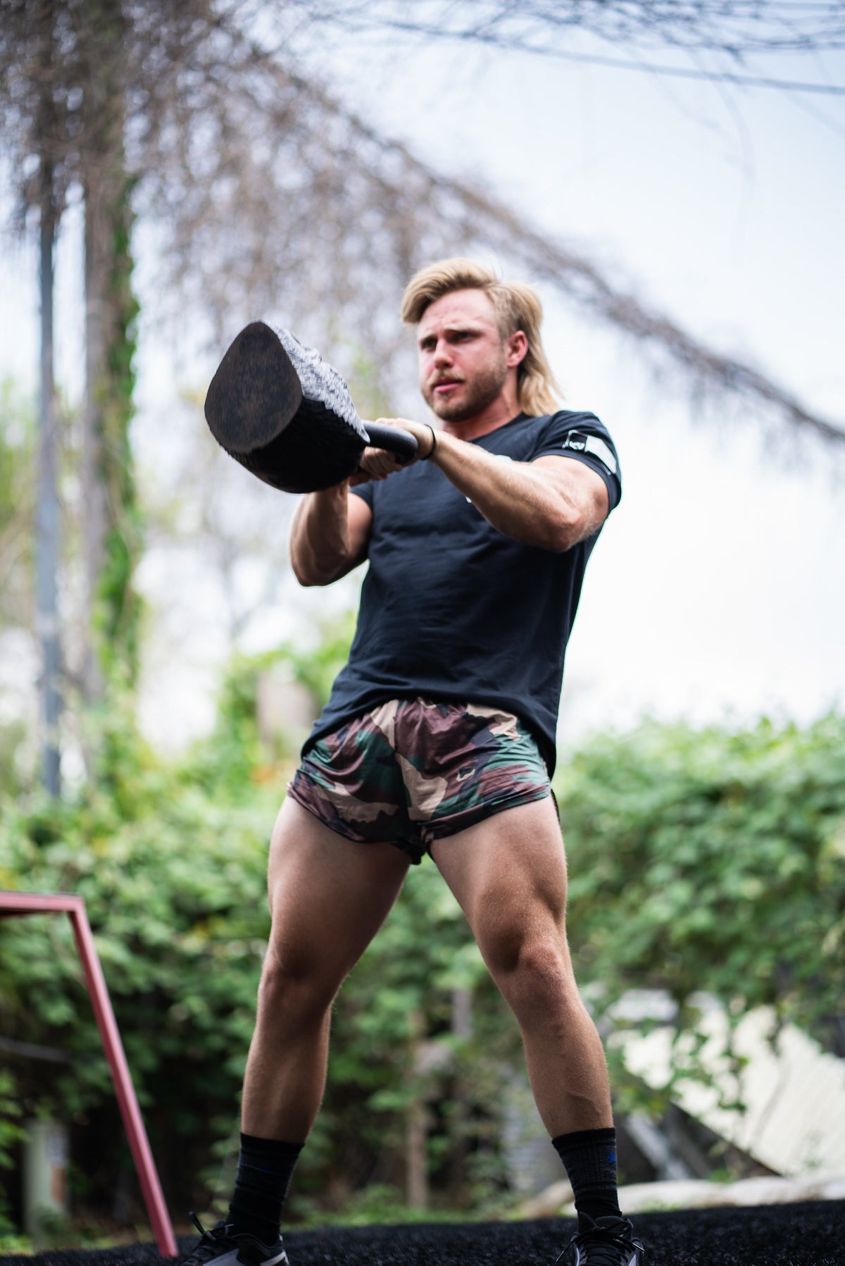 Woodland camo boxer shorts with elastic waistband, muted green pattern
