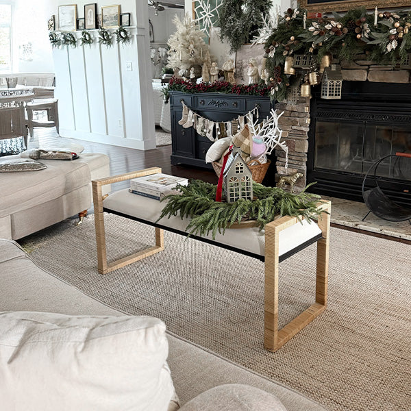 Woven rattan wooden bench with white cushion and light wood frame