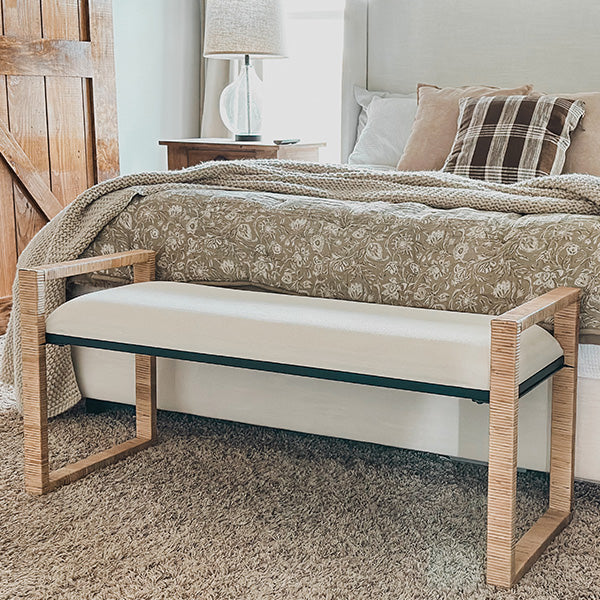 Woven rattan wooden bench with beige seat cushion and woven light wood frame