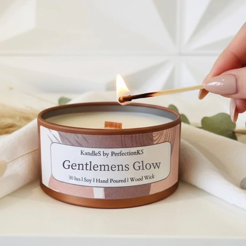 Wooden-wick soy candle in bronze tin, flame centered in open lid