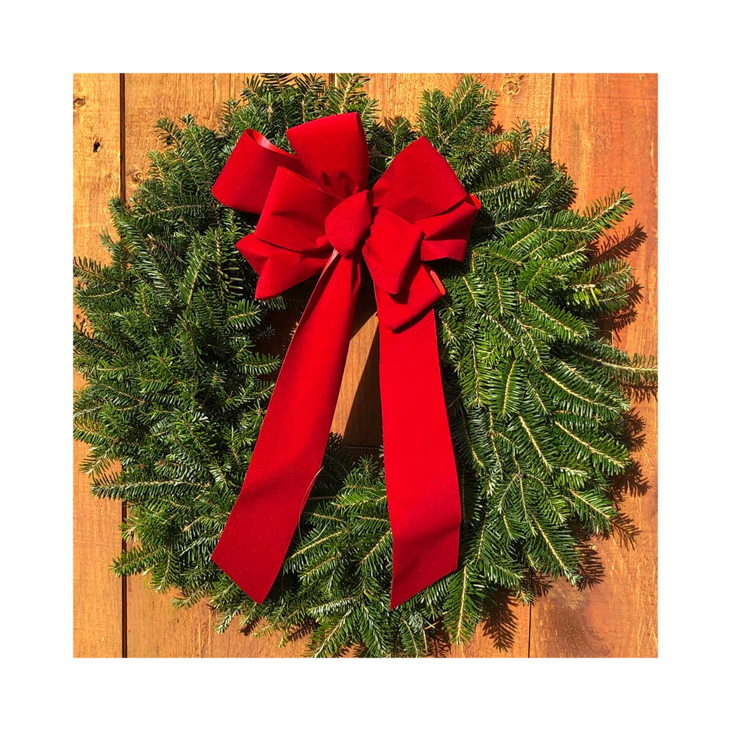 Balsam fir wreath with large red bow and long ribbon tails