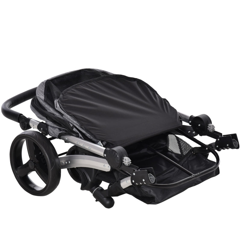 Pet stroller with black canopy cover, gray fabric body, and visible frame and wheels.