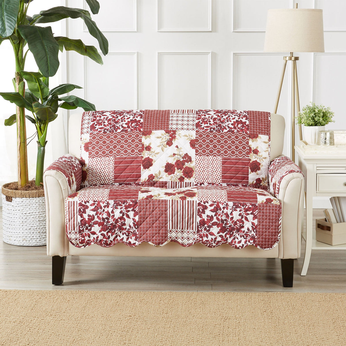 Reversible recliner protector on chair with mixed red patchwork floral, stripe, and lattice print