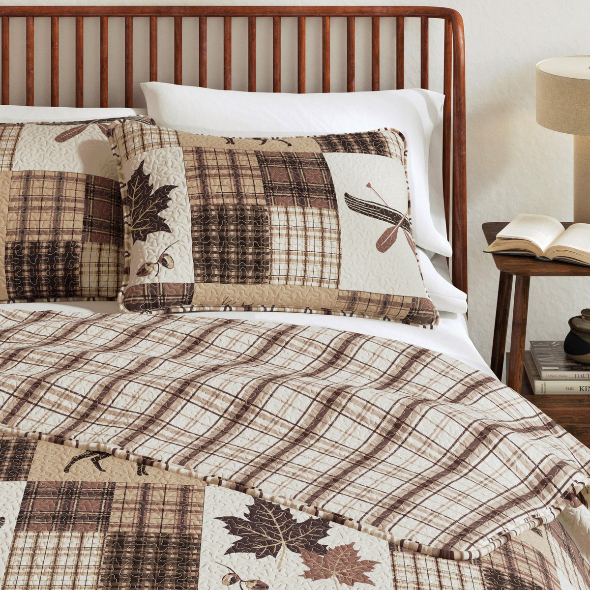 Bed quilt and pillow set with plaid patchwork and deer-and-leaf motif squares