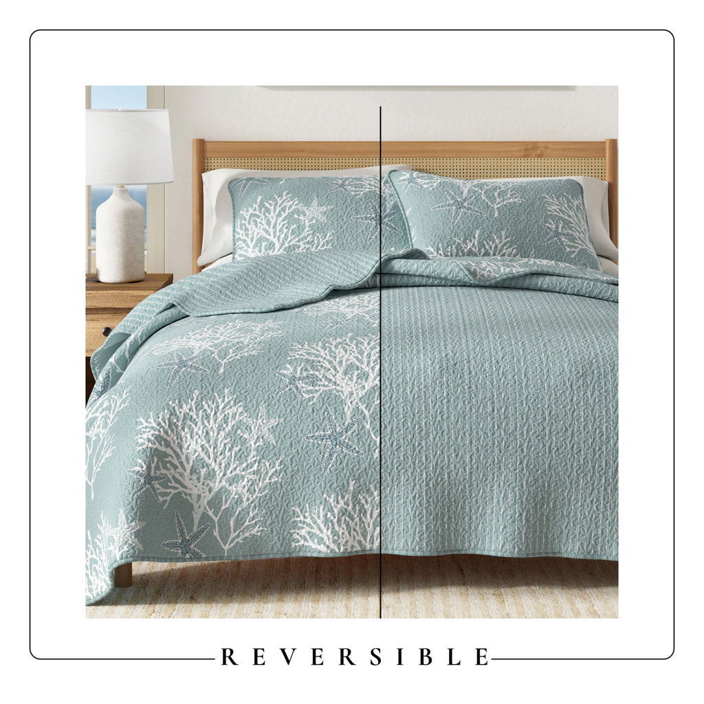 Blue quilt set with white tree-branch pattern and matching pillow shams