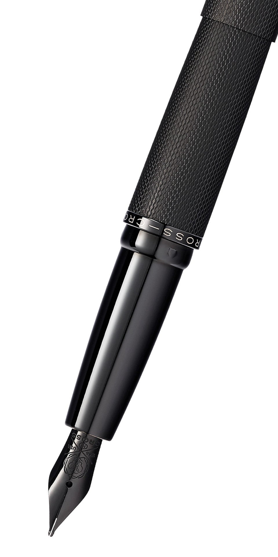 Close-up of brushed black fountain pen nib and textured barrel grip