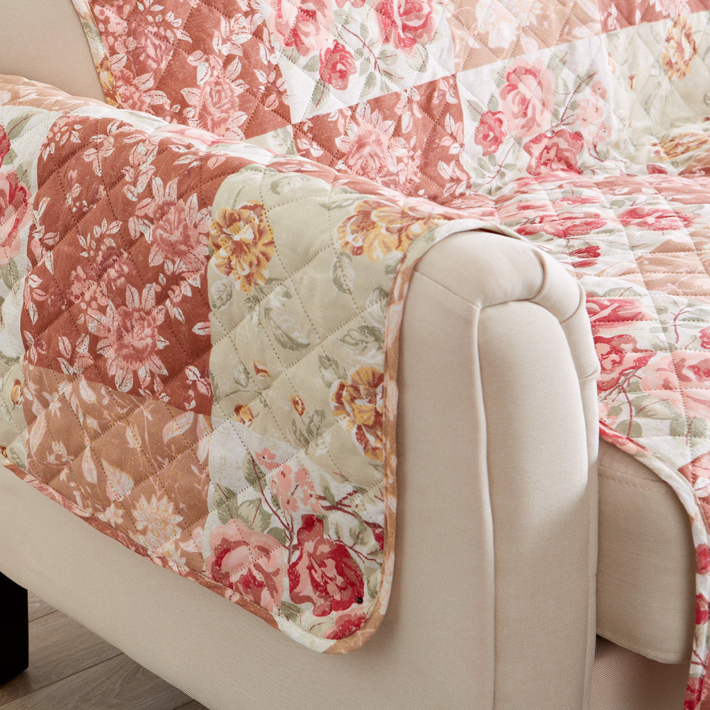 Side view of quilted floral patchwork protector in burgundy and cream fabrics