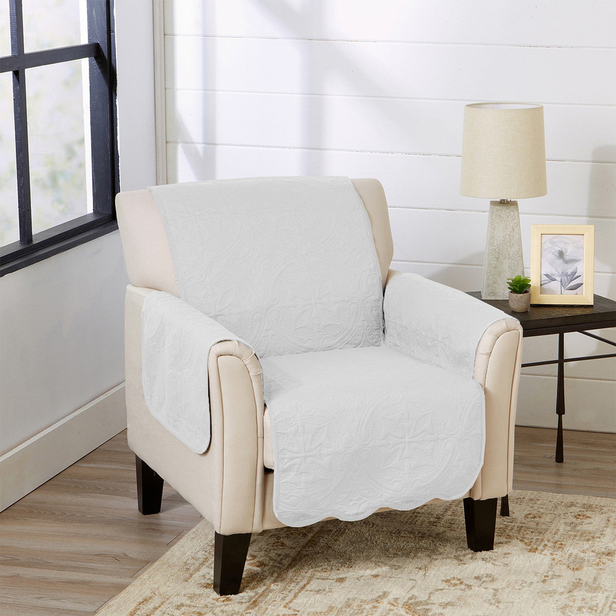 White armchair furniture protector with beige armrest covers and quilted fabric