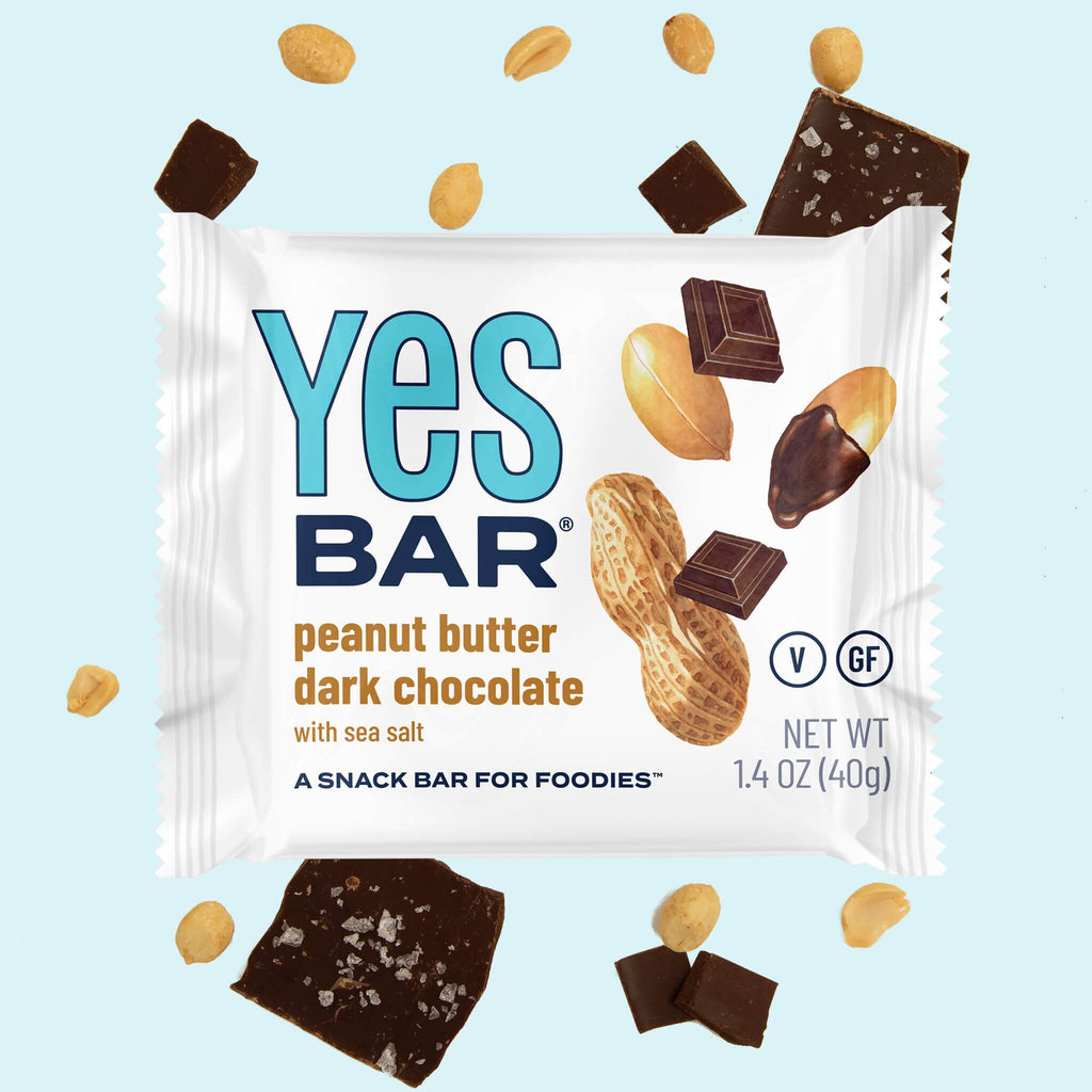 Single Yes Bar peanut butter dark chocolate snack bar package with peanuts and cocoa squares