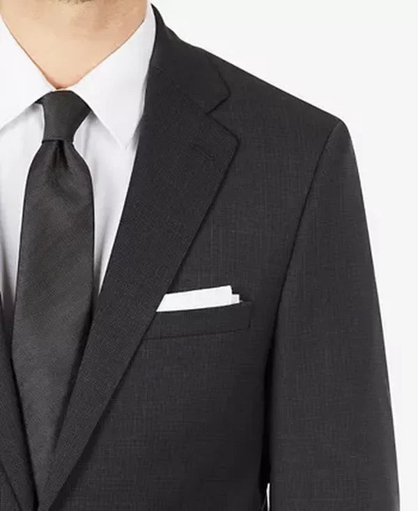 Men's suit jacket close-up, dark charcoal notch lapel and chest pocket