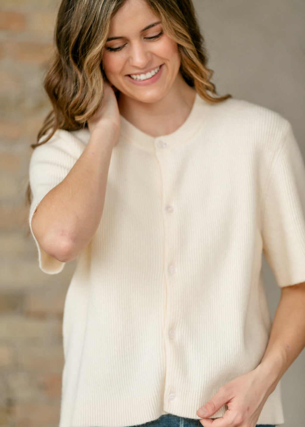 Ivory button-front short-sleeve cardigan, ribbed knit close-up