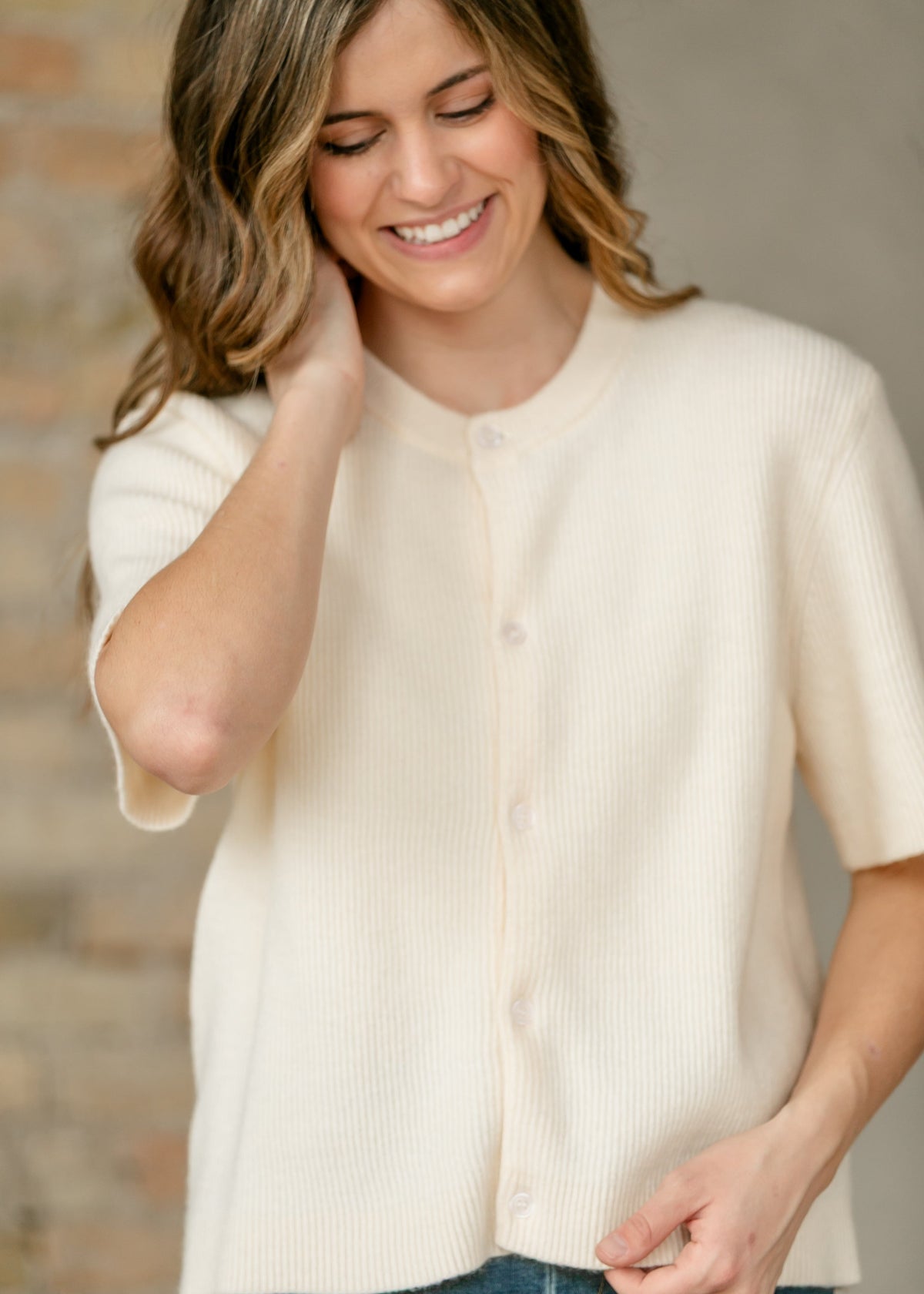 Ivory button-front short-sleeve cardigan, ribbed knit close-up