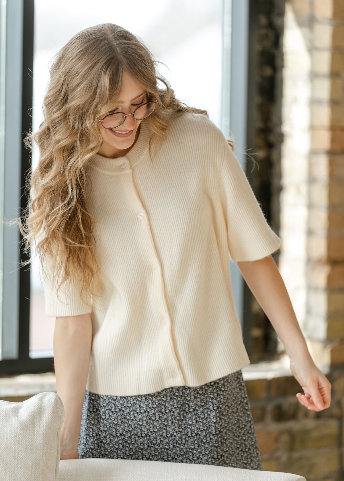 Ivory knit cardigan with button placket and short sleeves, ribbed cuffs