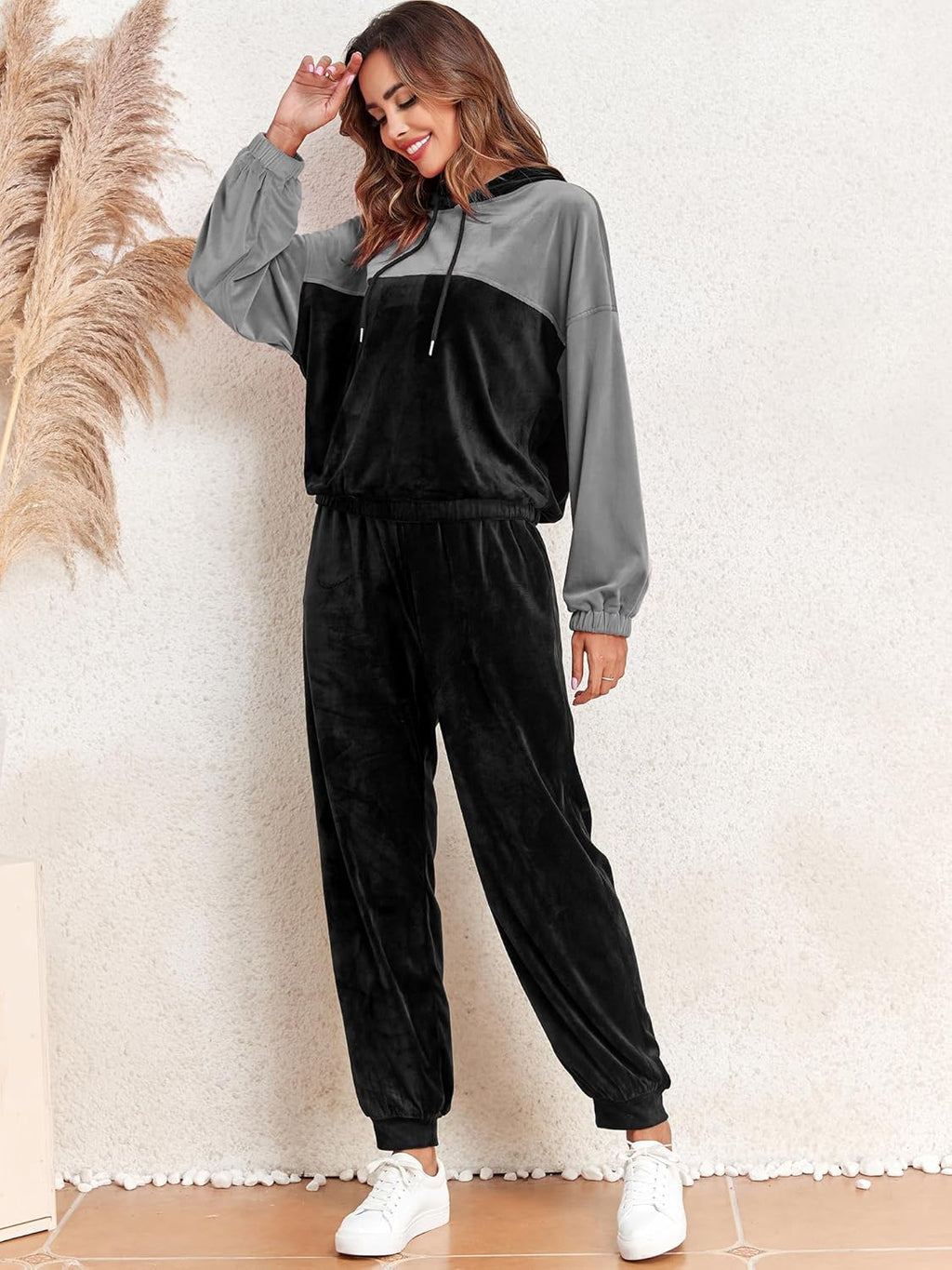 Grey and black velour lounge set: pullover hoodie with drawstrings and tapered jogger pants