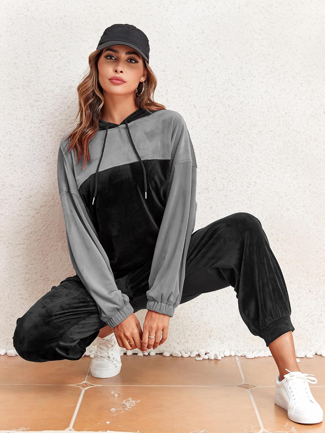 Grey and black velour hoodie and jogger pants set with drawstring hood and side pockets