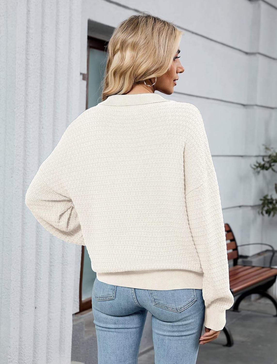 Off-white textured knit quarter-zip pullover sweater, shown from back view.