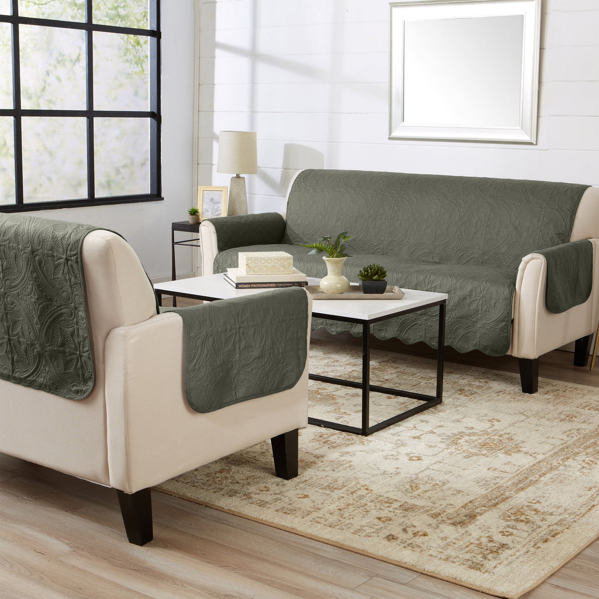 Green recliner protector on chairs with beige arms and quilted medallion fabric