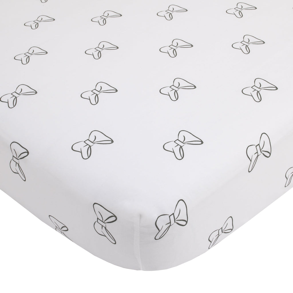 Crib fitted sheet with light grey background and Minnie Mouse bow pattern